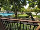 View from the balcony overlooking the swimming pool and garden area