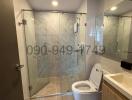 Modern bathroom with glass shower and tiled walls