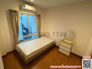 Cozy bedroom with natural light and air conditioning unit