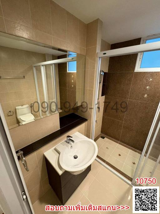Modern bathroom with shower cabin and vanity