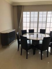 Elegant dining room with circular table and comfortable seating