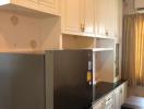 Modern kitchen with stainless steel appliances and white cabinetry