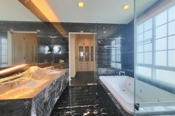 Modern bathroom interior with marble finish and luxury fixtures