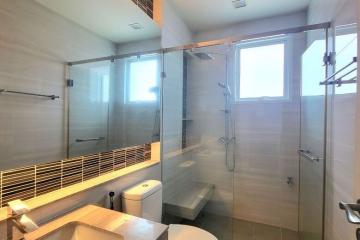 Modern bathroom with walk-in shower and large window