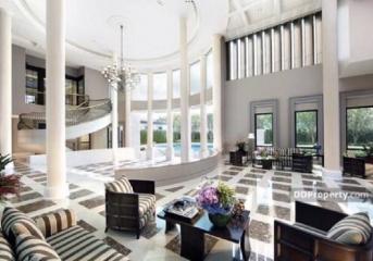 Elegant and spacious living room with high ceiling and luxurious decor