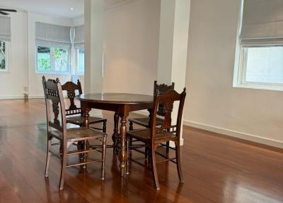 Spacious dining room with hardwood floors and ample natural light