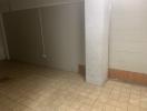 Empty interior space with tiled flooring and bare walls