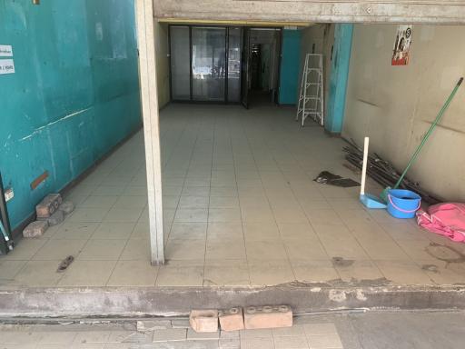 Spacious unfurnished interior of a commercial building entrance with tiled floors