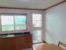 Bright kitchen with wooden cabinets and a dining table