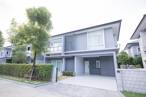 Modern two-story house with garage and front yard