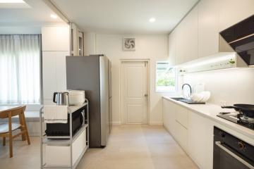 Modern kitchen interior with clean counters and stainless steel appliances