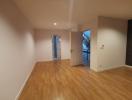 Spacious unfurnished room with hardwood floors