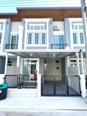 Contemporary two-story house with balcony and garage