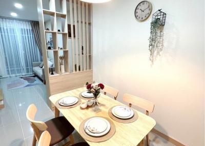Modern dining area with set table and contemporary decor