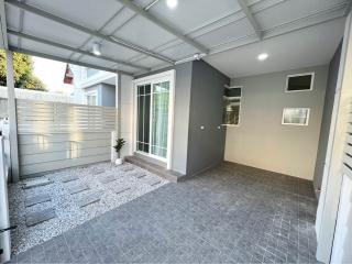 Spacious and modern patio with tiled flooring and ample natural light