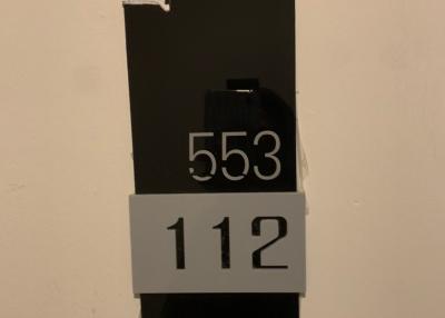 Image of a number sign on a wall, not representative of a living space