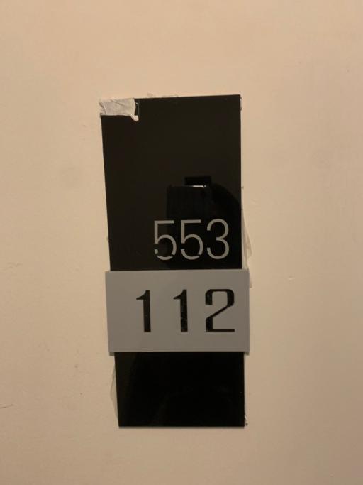 Image of a number sign on a wall, not representative of a living space