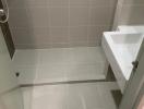 Compact bathroom interior with tiled walls and flooring