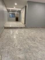 Spacious building entrance with marble flooring