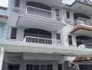 Three-story residential building with balconies