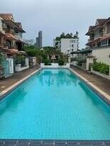 Outdoor swimming pool with surrounding residential buildings