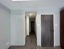Modern hallway with wooden flooring and neutral wall colors