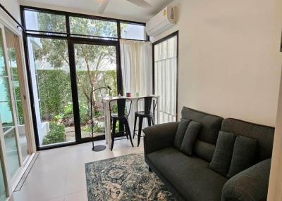 Cozy living room with sofa and garden view