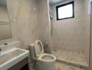 Modern bathroom interior with marble tiles and natural light