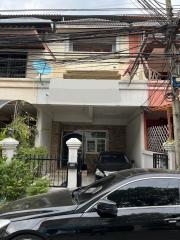 Front view of a two-story house with car parked outside