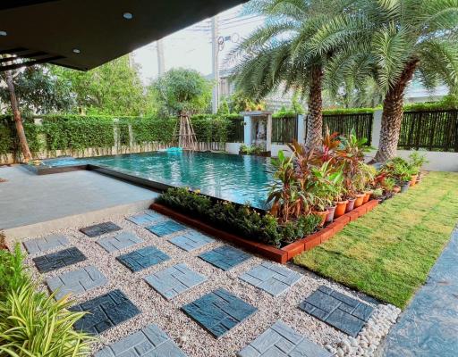 Spacious backyard with swimming pool and landscaping