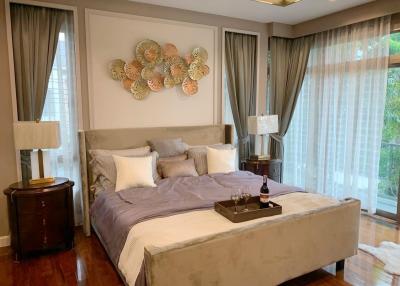 Elegant Master Bedroom with Natural Light and Modern Decor