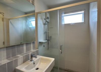 Modern bathroom with walk-in shower and sink