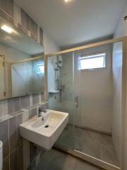 Modern bathroom with walk-in shower and sink