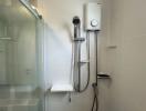 Modern bathroom with glass shower and wall-mounted water heater