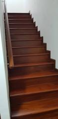 Elegant wooden staircase with a polished handrail
