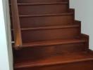 Elegant wooden staircase with a polished handrail