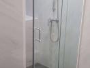 Modern bathroom with glass shower enclosure and shower fixtures
