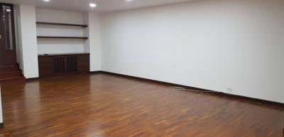 Spacious empty living room with hardwood flooring