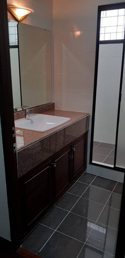 Modern bathroom interior with vanity and large mirror