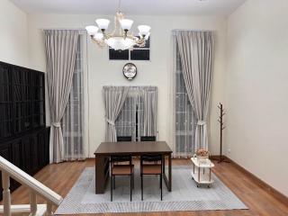 Elegant dining room with a large table and chandelier