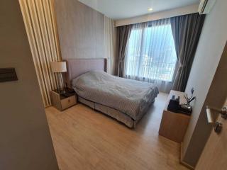 Cozy bedroom with large bed and natural light