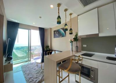 Modern kitchen with open plan design leading to a balcony