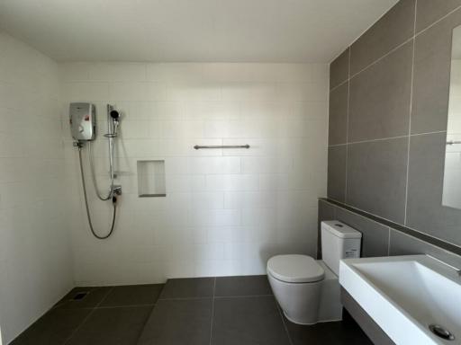 Modern bathroom with white tiles and walk-in shower