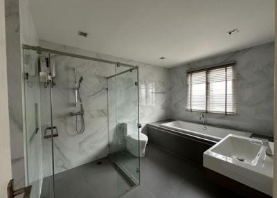 Modern bathroom with a walk-in shower and a bathtub