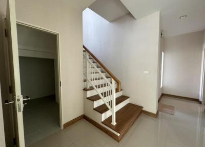 Bright interior space with staircase leading to upper level