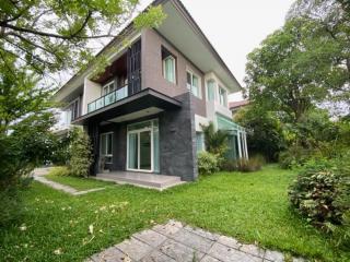 Exterior view of a two-story house with a garden