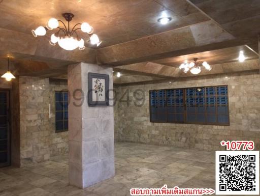 Spacious interior with tiled flooring and recessed lighting