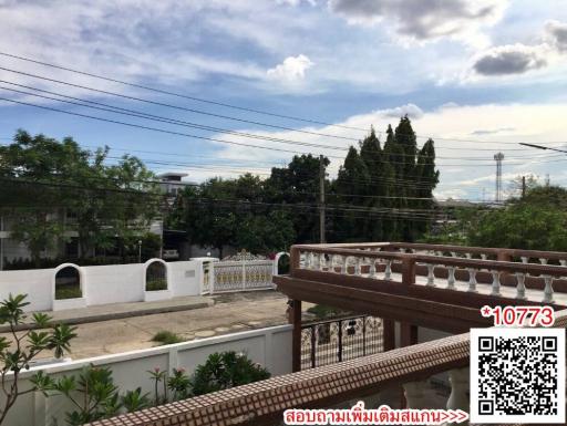 Panoramic view from a residential balcony showcasing the surrounding neighborhood and sky