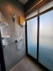 Modern bathroom with a shower and frosted glass window