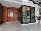 Elegant house entrance with wooden door and large windows